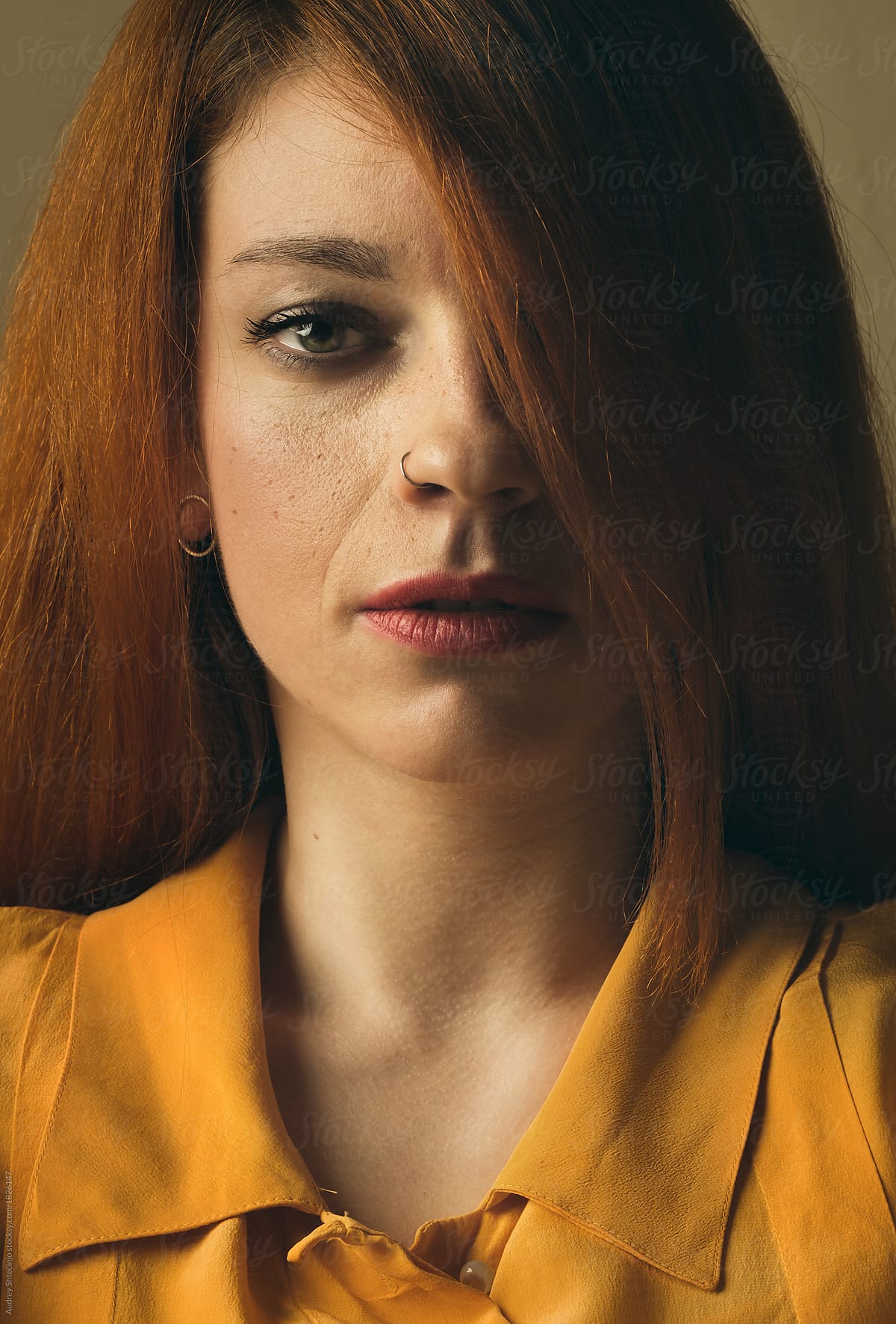 "Gingrer Grill In Yellow Portrait" by Stocksy Contributor "AUDSHULE